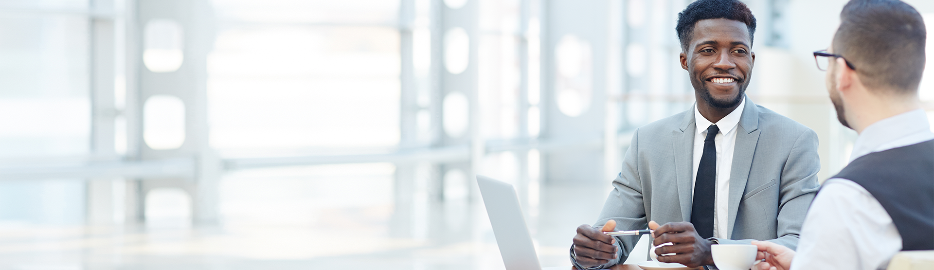 Employees meeting over coffee